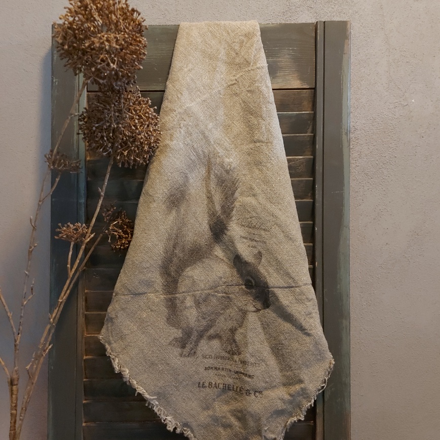 Shabby doek met de afbeelding van een Schotse Hooglander, in sepia tinten.