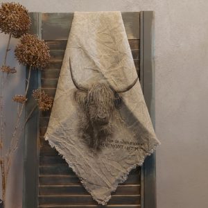 Shabby doek met de afbeelding van een Schotse Hooglander, in sepia tinten.