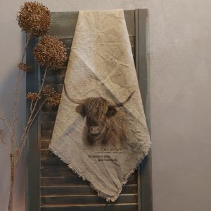 Shabby doek met de afbeelding van een Schotse Hooglander, in sepia tinten.
