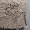 Shabby doek van naturel linnen met een tekst over thee.