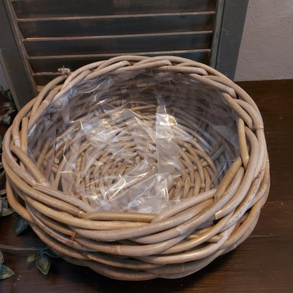 Ronde mand van rattan voor planten.
