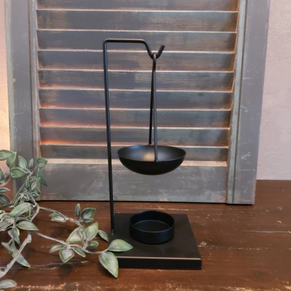 Brander voor amberblokjes en wax, van zwart metaal.