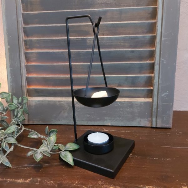 Brander voor amberblokjes en wax, van zwart metaal.