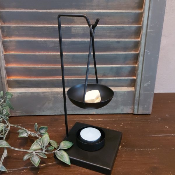 Brander voor amberblokjes en wax, van zwart metaal.