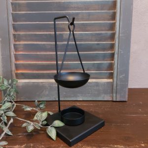 Brander voor amberblokjes en wax, van zwart metaal.