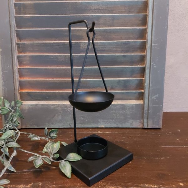 Brander voor amberblokjes en wax, van zwart metaal.