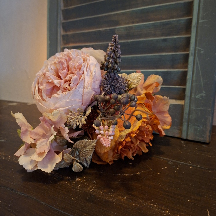 Boeketje kunstbloemen in een roze en oranje kleur van het merk Sylxz.